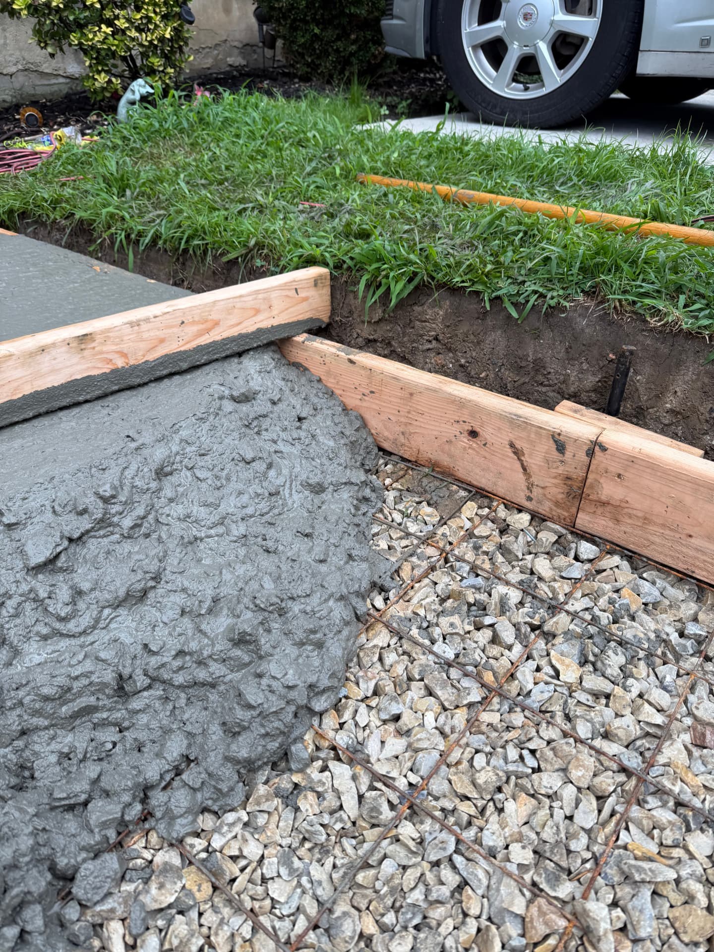 Newly poured concrete driveway with clean broom finish