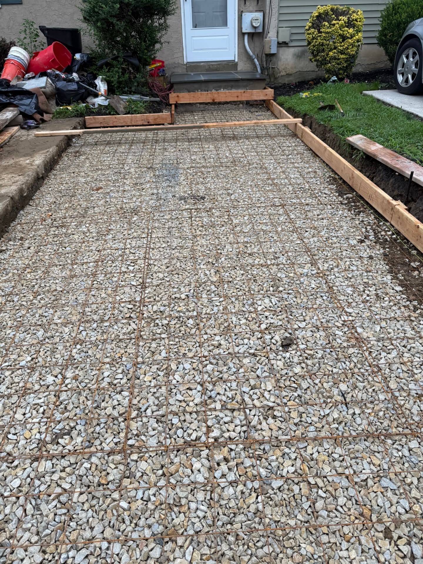 Masonry steps and retaining wall built alongside new concrete