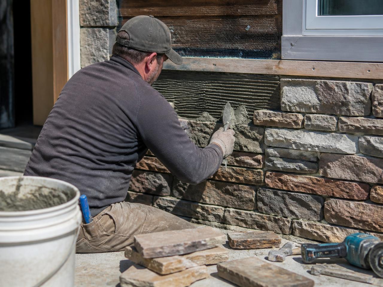 Stone patio and seating wall constructed for a Delaware County home