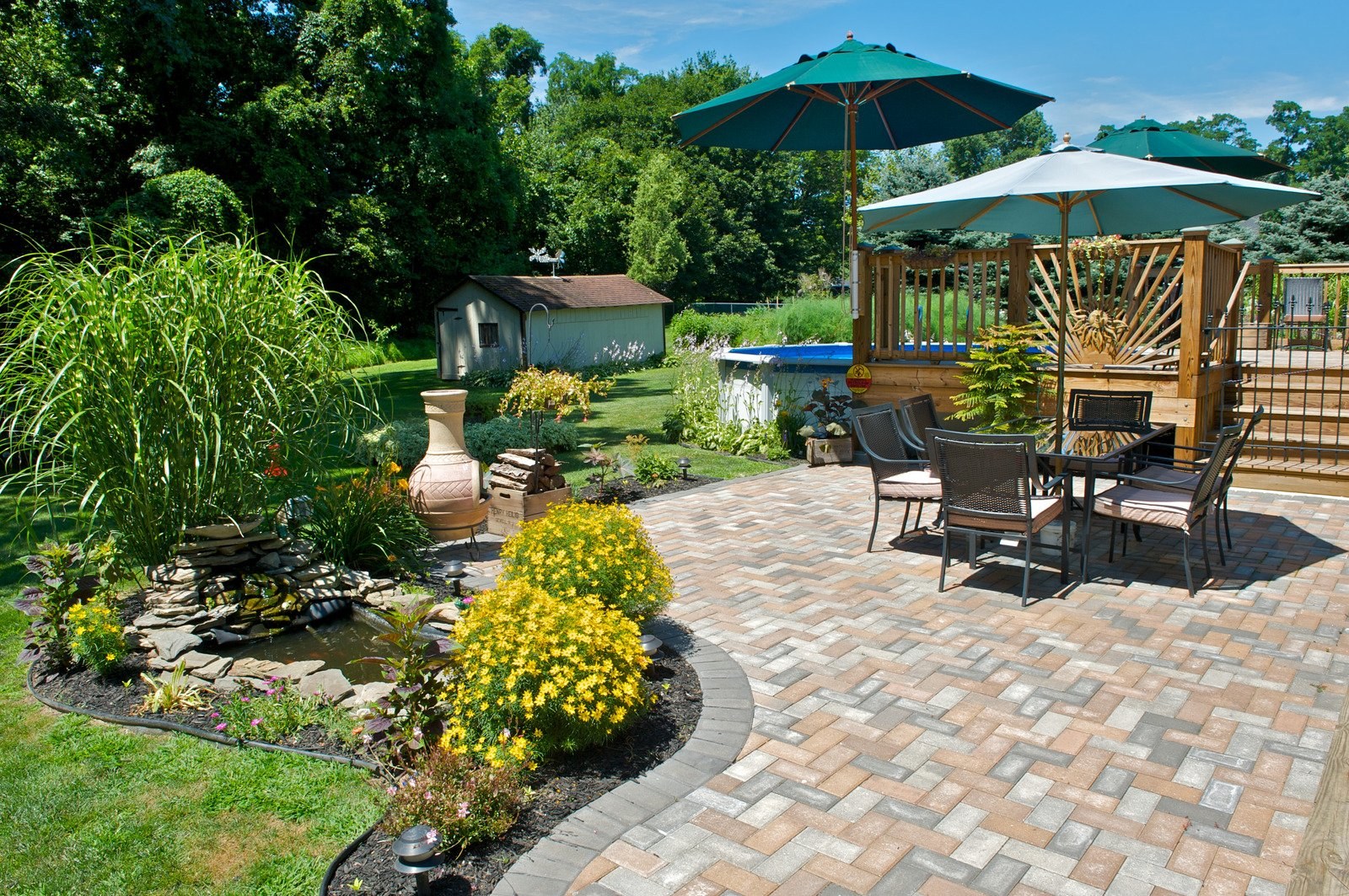 Concrete base and walkway leading to a patio installation