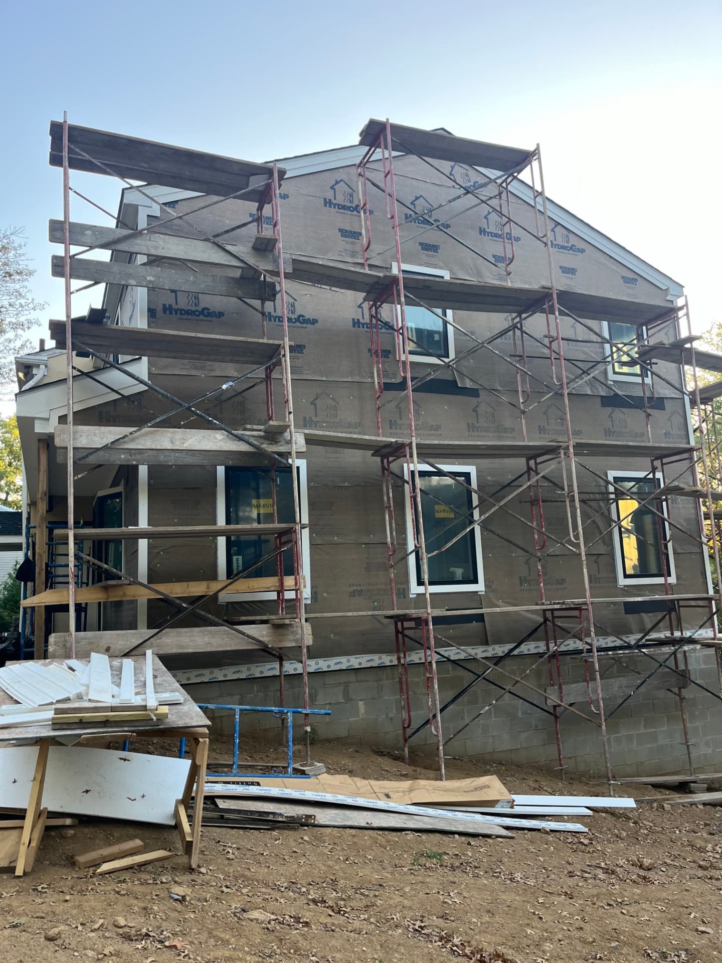 Elastomeric coating applied over resurfaced stucco