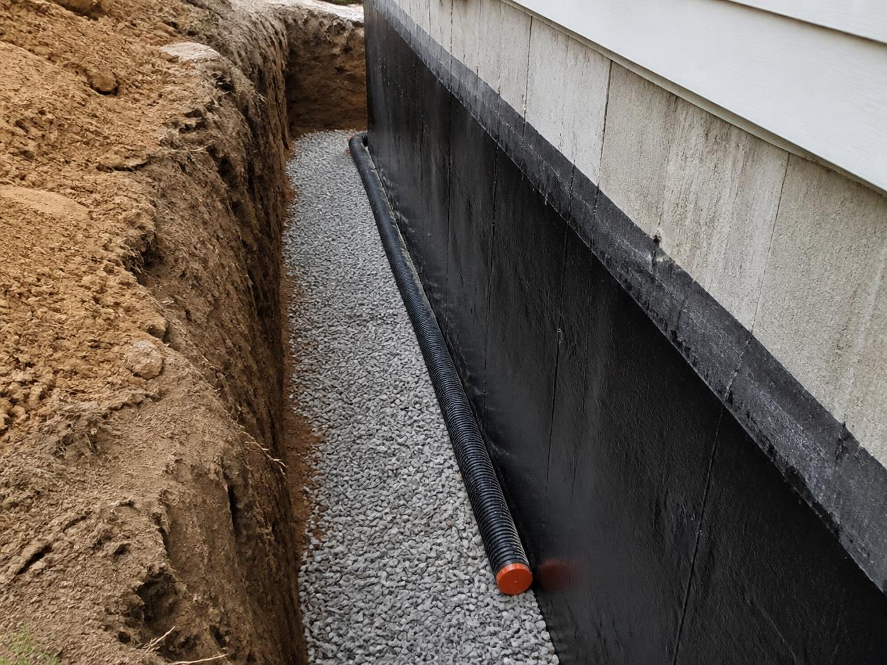 Foundation wall repaired and parged before sealing