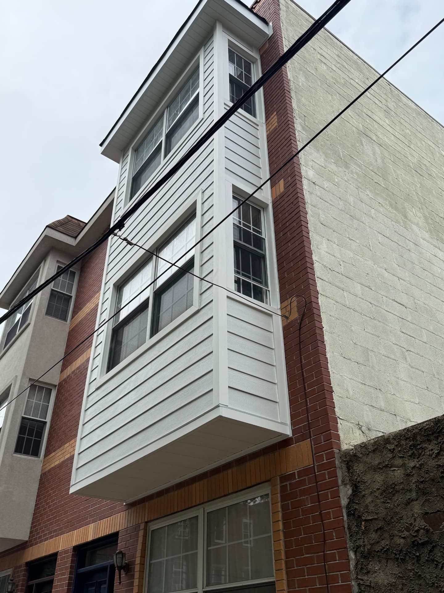 Completed stucco and masonry restoration project by SMG Plastering INC